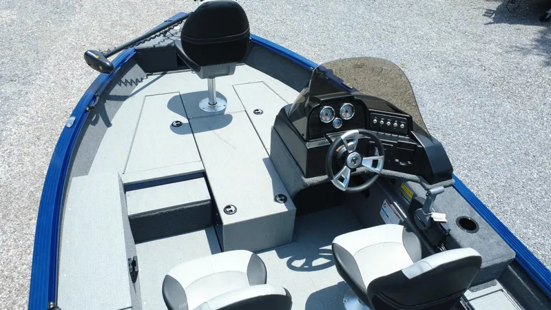 Slide: The Image of 2025 G3 Angler V164 C boat interior with steering console and seating. - 9