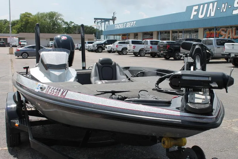 Slide: The Image of 2021 Ranger Z175 boat parked outside a tackle shop, ready for fishing adventures. - 6