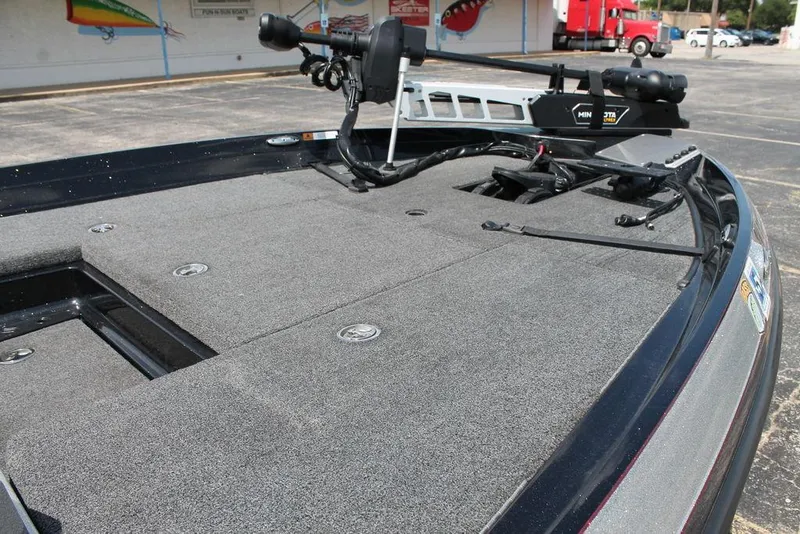 Slide: The Image of 2021 Ranger Z175 boat deck with trolling motor in parking lot. - 9