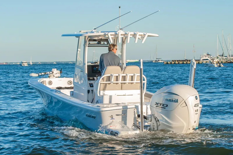 Slide: The Image of 2026 Regulator 26XO boat cruising on open water with Yamaha engine. - 5