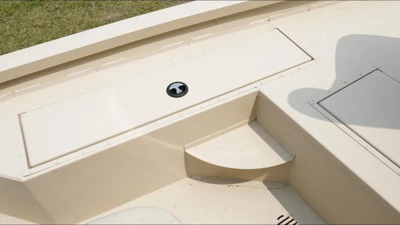 Slide: The Image of 2025 G3 Bay 19 GX boat interior with storage compartments and seating. - 11