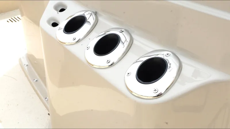 Slide: The Image of Rod holders on a 2025 G3 Bay 19 GX boat, featuring sleek chrome finishes. - 19