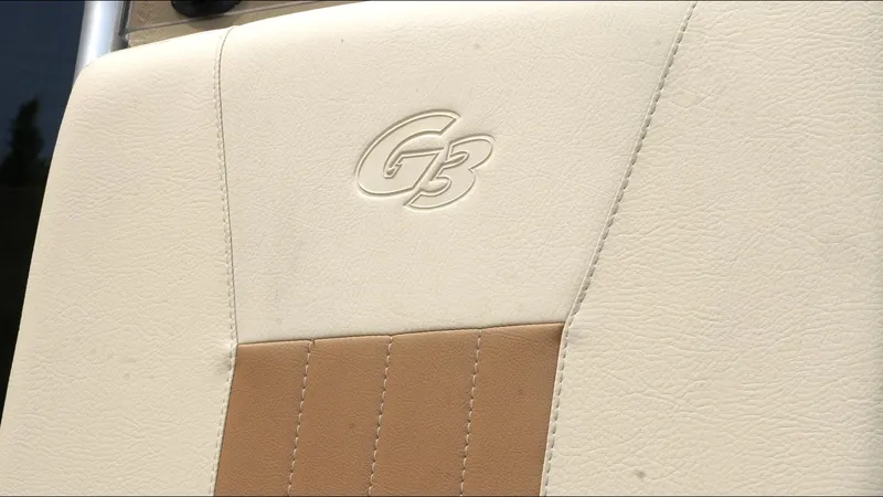 Slide: The Image of Close-up of G3 Bay 19 GX 2025 boat seat with embossed logo. - 21