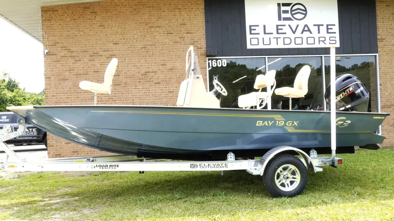 Slide: The Image of 2025 G3 Bay 19 GX boat on trailer at Elevate Outdoors dealership. - 5