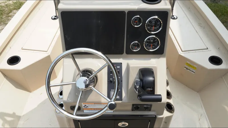 Slide: The Image of Steering console of 2025 G3 Bay 19 GX boat with gauges and controls. - 8