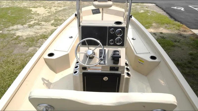 Slide: The Image of 2025 G3 Bay 19 GX boat interior with steering wheel and control panel. - 9