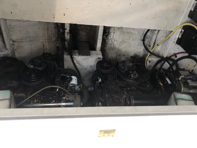 Slide: The Image of Engine compartment of a 2004 Cruisers Yachts 280 Express, showing mechanical components and wiring. - 11