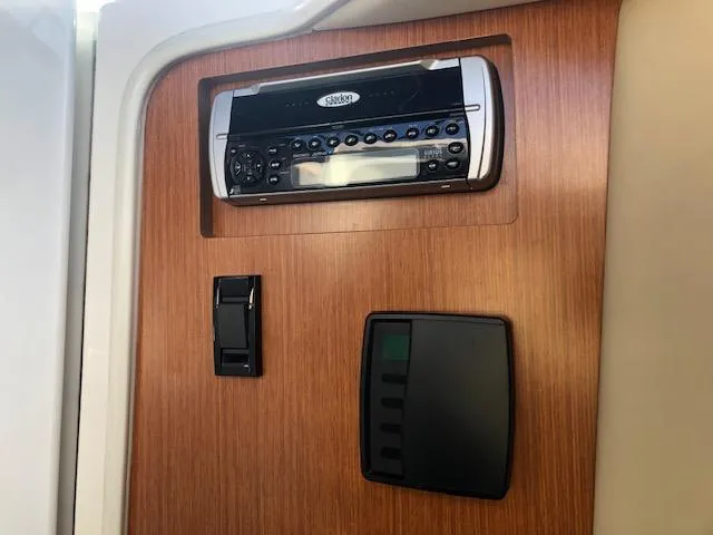 Slide: The Image of 2004 Cruisers Yachts 280 Express interior with stereo system and control panel. - 20