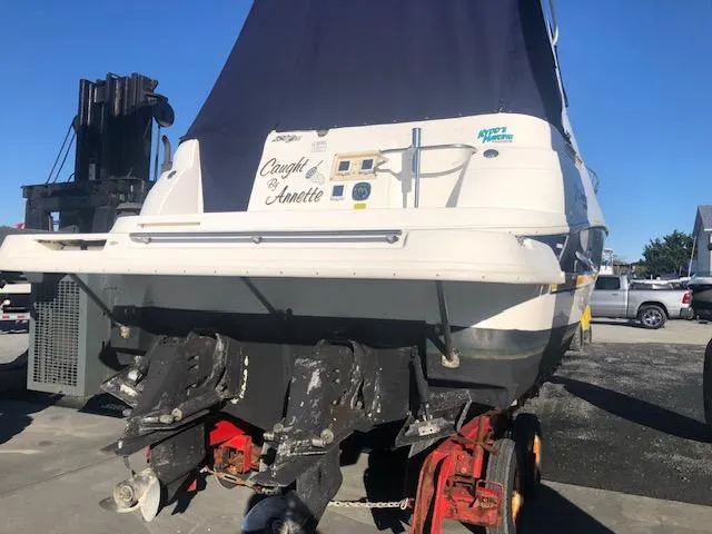 Slide: The Image of 2004 Cruisers Yachts 280 Express boat on trailer, rear view, sunny day. - 22