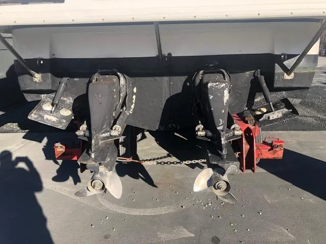 Slide: The Image of 2004 Cruisers Yachts 280 Express boat stern with dual propellers and outdrives. - 23