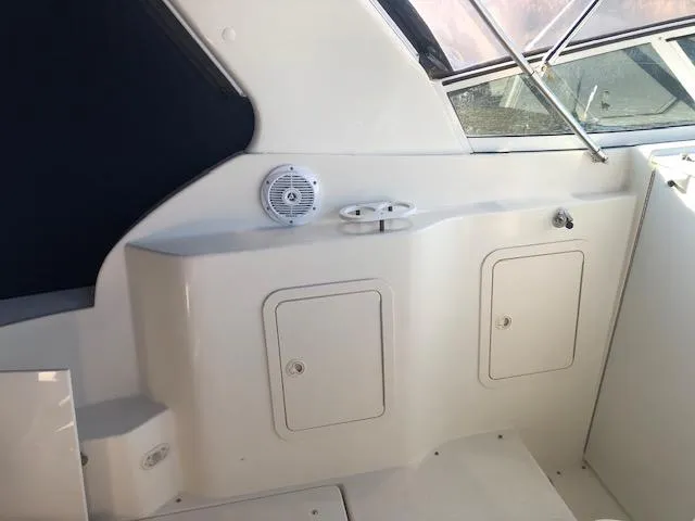 Slide: The Image of 2004 Cruisers Yachts 280 Express interior with storage compartments and speaker. - 6