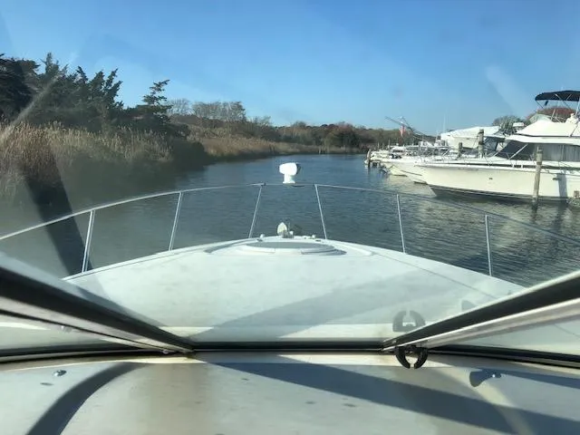 Slide: The Image of Bow view from 2004 Cruisers Yachts 280 Express navigating a narrow waterway. - 9