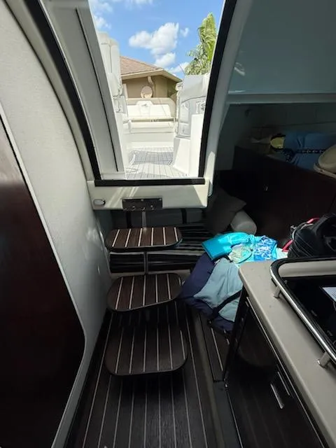 Slide: The Image of Interior view of 2019 Monterey 295 Sport Yacht with steps and cabin area. - 11