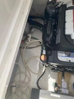 Slide: The Image of Engine compartment of a 2019 Monterey 295 Sport Yacht, showing mechanical components and wiring. - 15