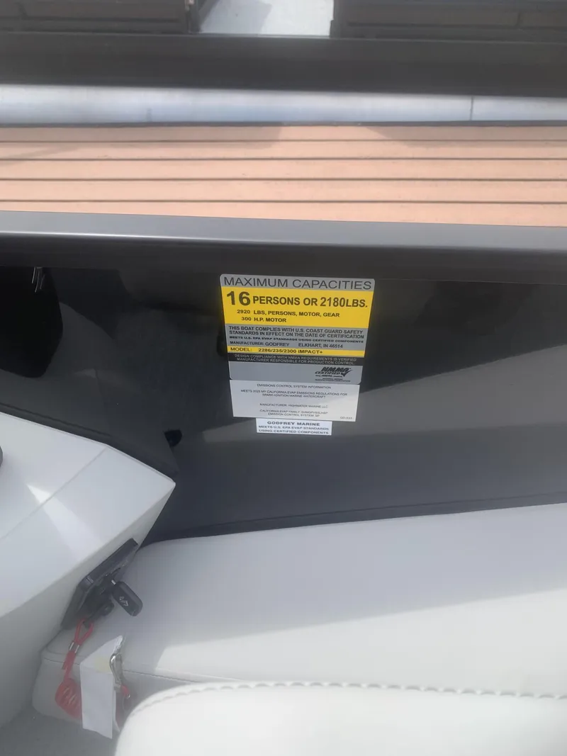 Slide: The Image of 2026 Godfrey Sweetwater 2286 FS boat capacity label, seating for 16 people or 2180 lbs. - 6