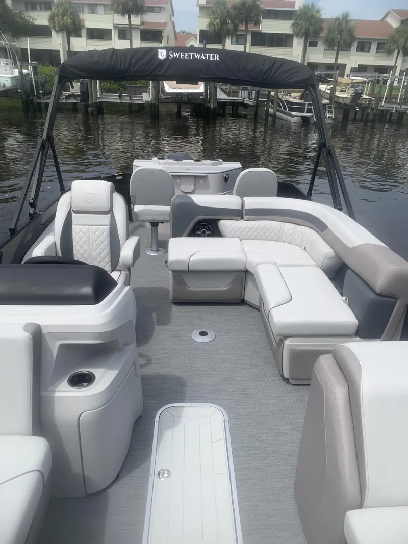 Slide: The Image of 2026 Godfrey Sweetwater 2286 FS pontoon boat interior with luxurious seating and modern design. - 8