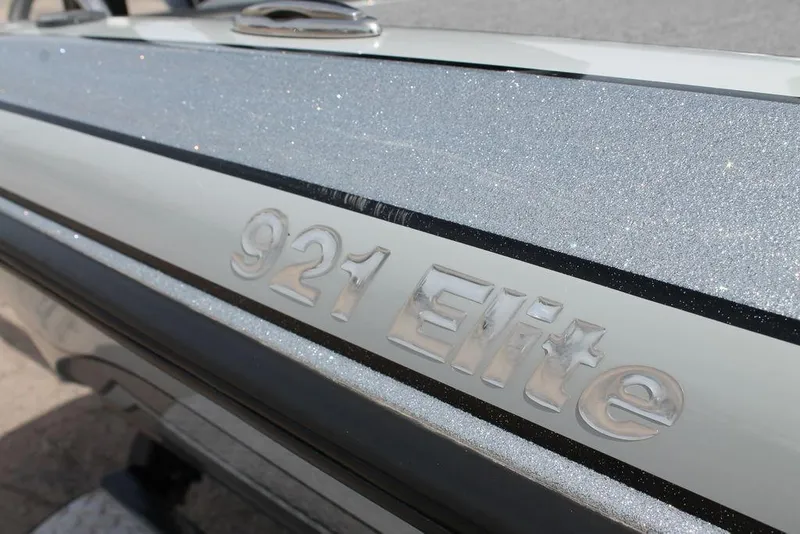 Slide: The Image of Close-up of 2020 Phoenix 921 ELITE boat model name on metallic surface. - 5