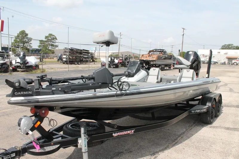 Slide: The Image of 2020 Phoenix 921 ELITE fishing boat with Garmin equipment on a trailer in a parking lot. - 8