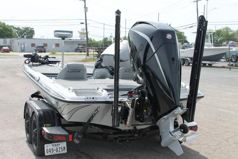 Slide: The Image of 2020 Phoenix 921 ELITE boat on trailer, rear view with motor and license plate visible. - 9