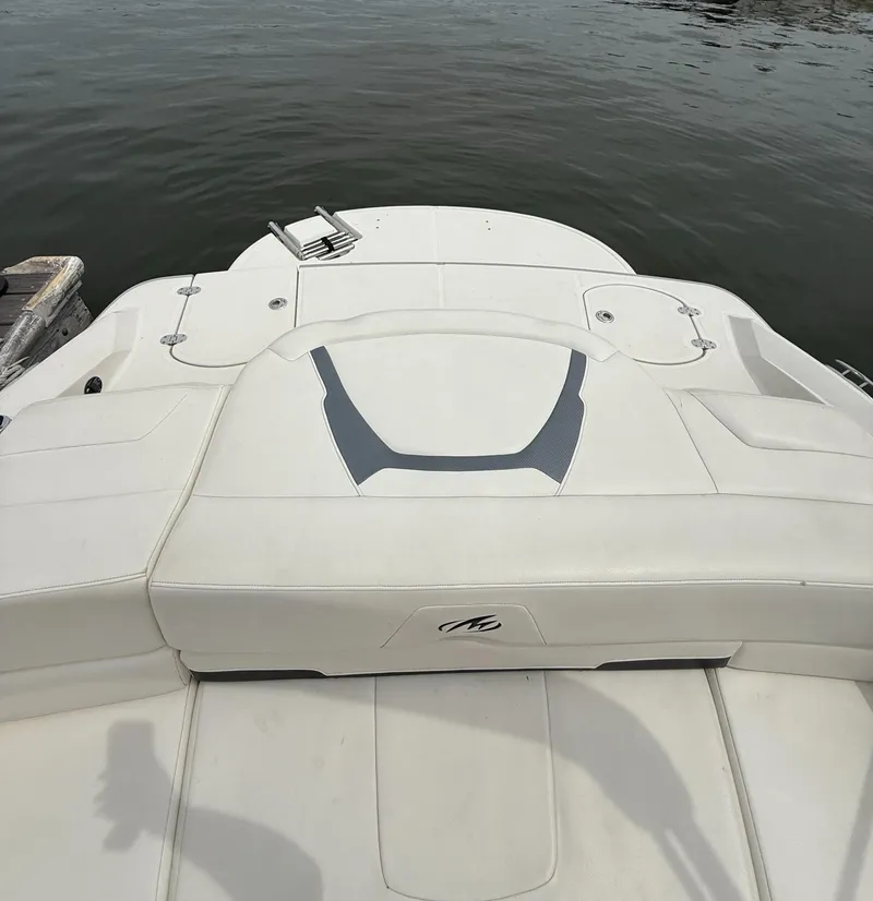 Slide: The Image of 2012 Monterey 204FS boat stern view with swim platform on calm water. - 5