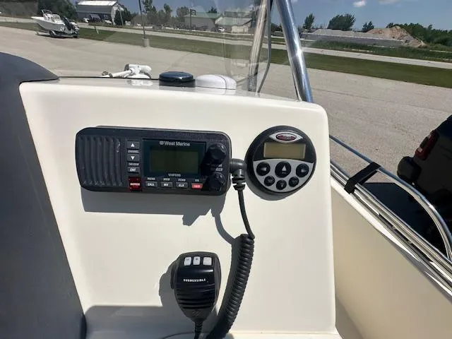 Slide: The Image of 2007 Boston Whaler 200 Dauntless console with marine radio and control panel. - 12