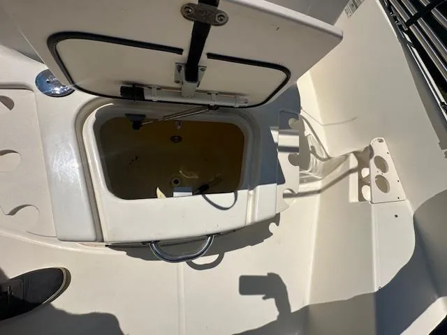 Slide: The Image of Open storage compartment on a 2007 Boston Whaler 200 Dauntless boat deck. - 14