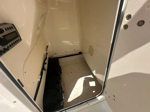 Slide: The Image of Interior view of a 2007 Boston Whaler 200 Dauntless boat storage compartment. - 17