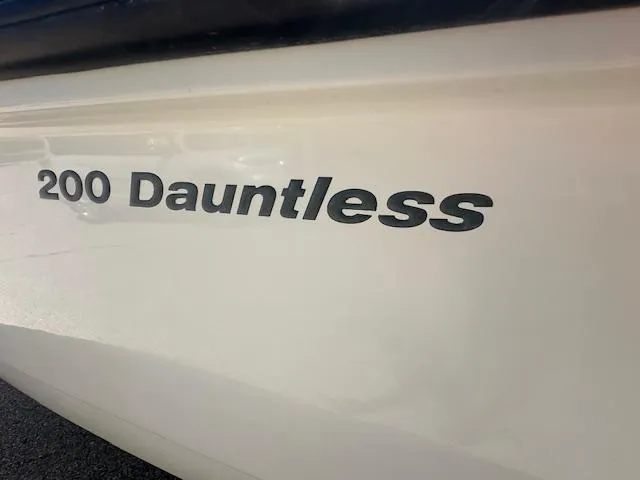 Slide: The Image of 2007 Boston Whaler 200 Dauntless boat model name on hull. - 4