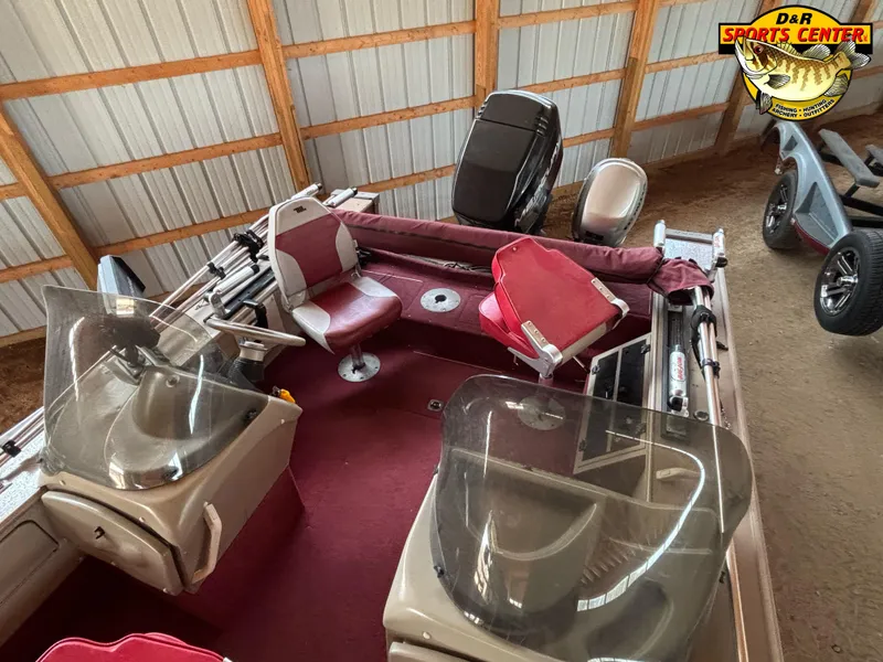 Slide: The Image of 1997 Lund 1900 Pro-V LE boat with red interior, stored indoors. - 5