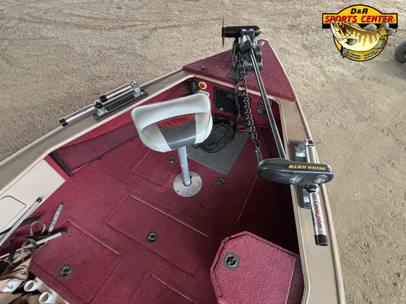 Slide: The Image of 1997 Lund 1900 Pro-V LE boat interior with red carpet and fishing equipment. - 7