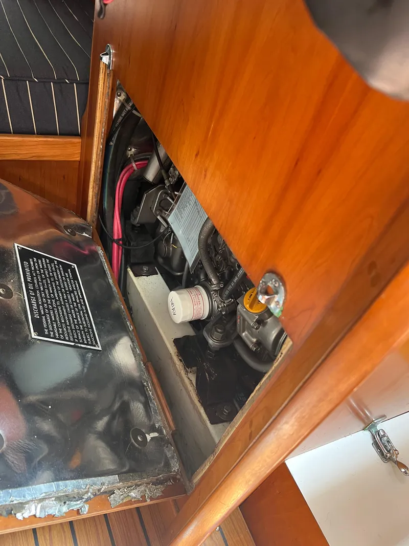 Slide: The Image of Engine compartment of a 2001 J Boats J/120 sailboat, showcasing interior components and wiring. - 16