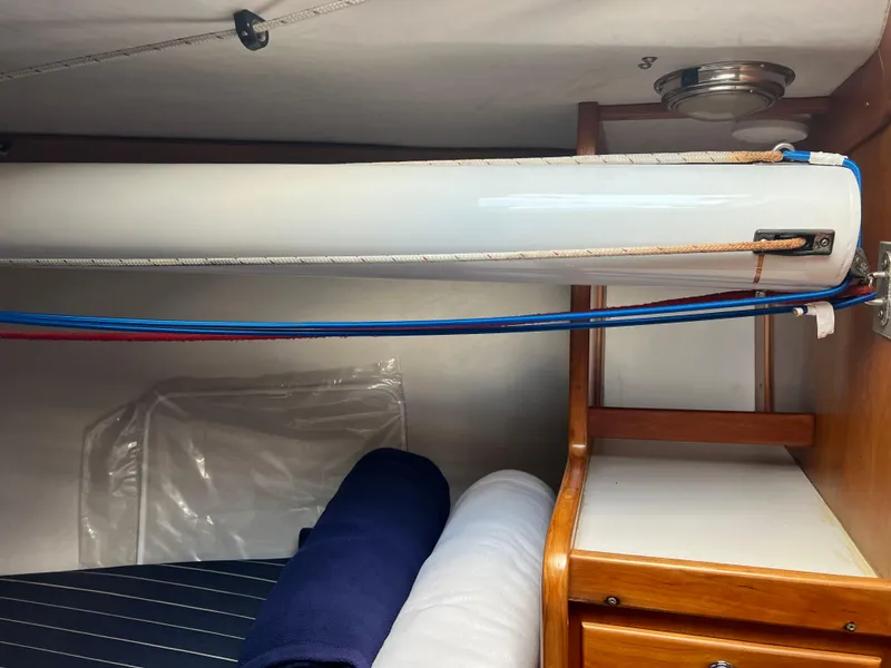 Slide: The Image of Interior of 2001 J Boats J/120 sailboat with ropes and wooden cabinetry. - 27