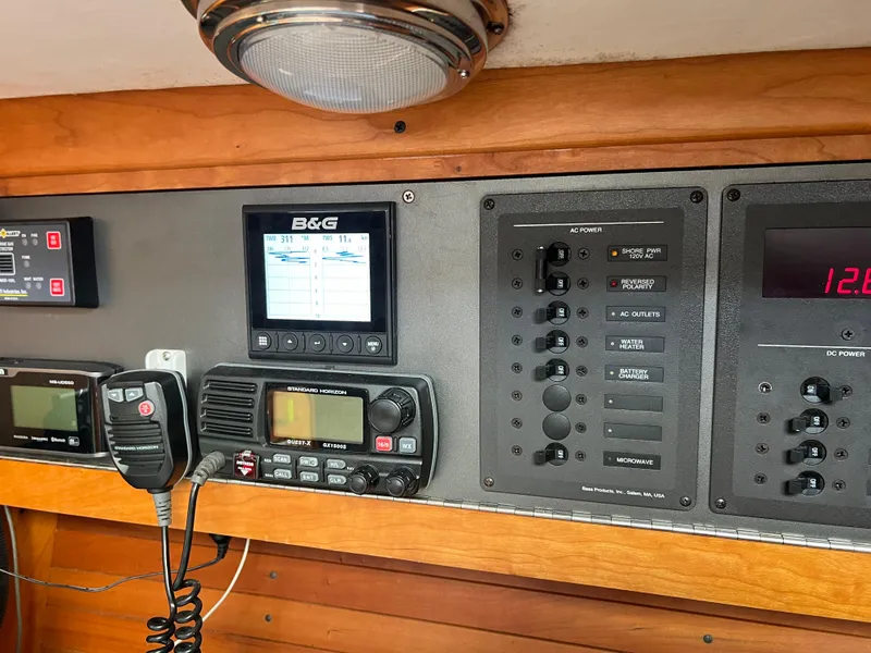 Slide: The Image of Control panel of a 2001 J Boats J/120 yacht with navigation and communication equipment. - 38