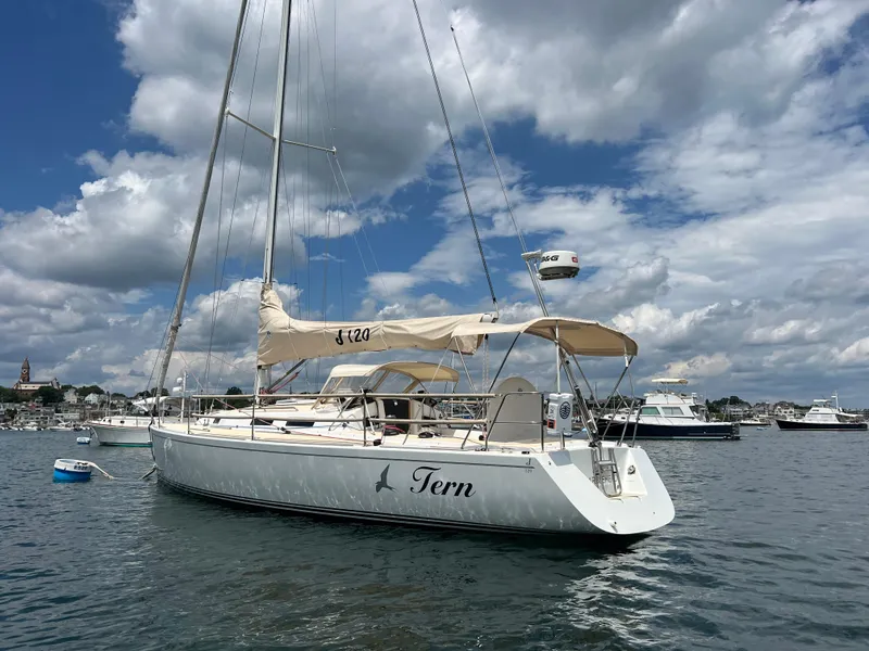 Slide: The Image of Sailboat J/120 from 2001 on calm water under a partly cloudy sky. - 4