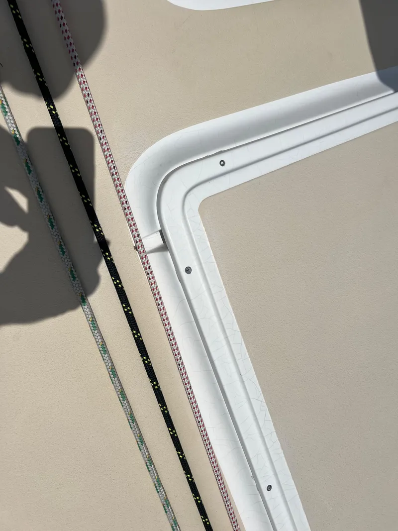 Slide: The Image of Close-up of 2001 J Boats J/120 deck with ropes and hatch detail. - 8