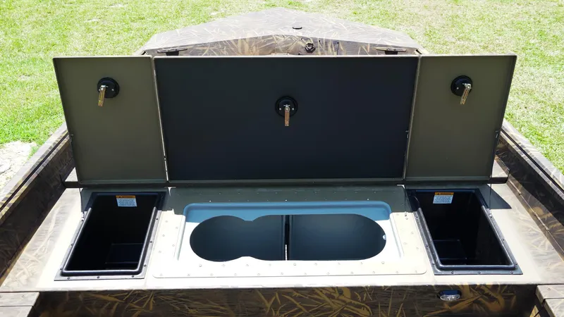 Slide: The Image of 2025 G3 Gator Tough 20 CC boat storage compartments open, showcasing interior design. - 10