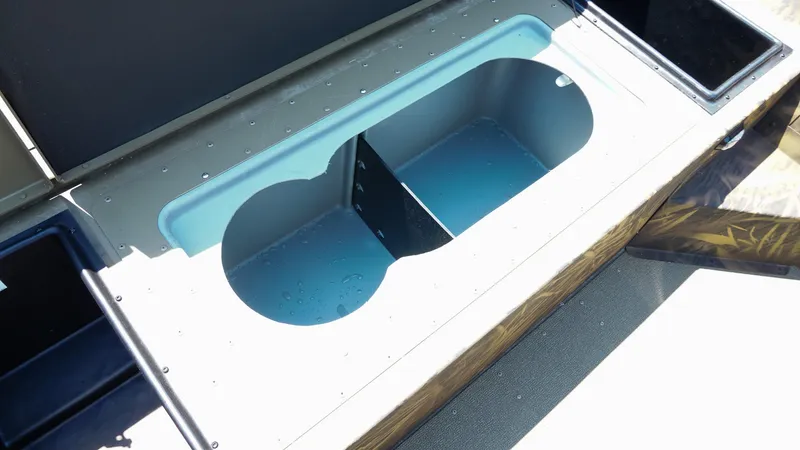 Slide: The Image of 2025 G3 Gator Tough 20 CC boat storage compartment, open and empty. - 11