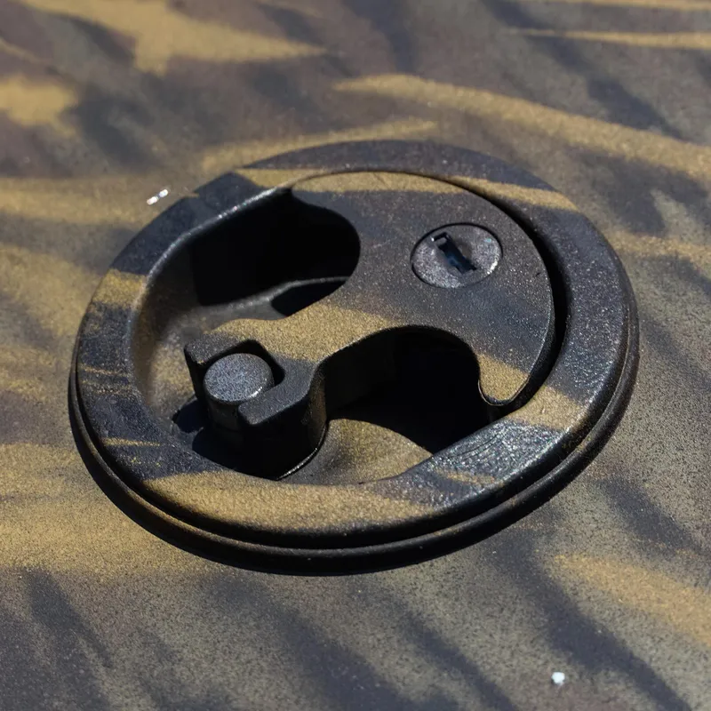 Slide: The Image of Close-up of 2025 G3 Gator Tough 20 CC boat latch on camo surface. - 13