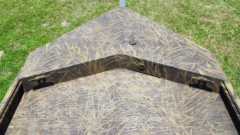 Slide: The Image of 2025 G3 Gator Tough 20 CC boat with camouflage pattern on grassy background. - 15