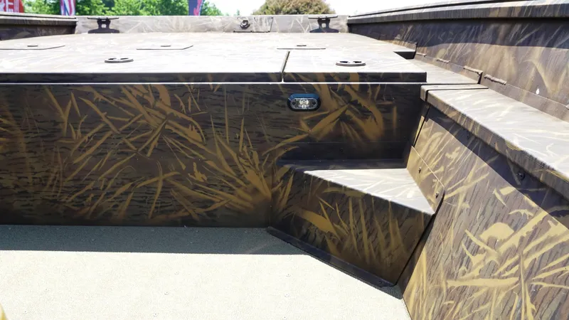 Slide: The Image of 2025 G3 Gator Tough 20 CC boat interior with camouflage design and seating. - 16