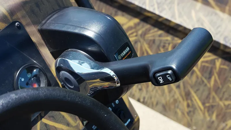 Slide: The Image of Close-up of 2025 G3 Gator Tough 20 CC boat throttle control. - 18