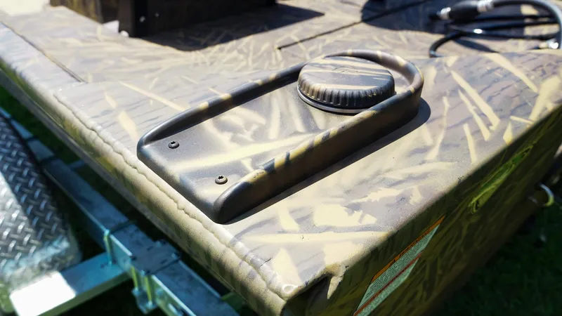 Slide: The Image of Camouflage-patterned deck of 2025 G3 Gator Tough 20 CC boat with fuel cap detail. - 5