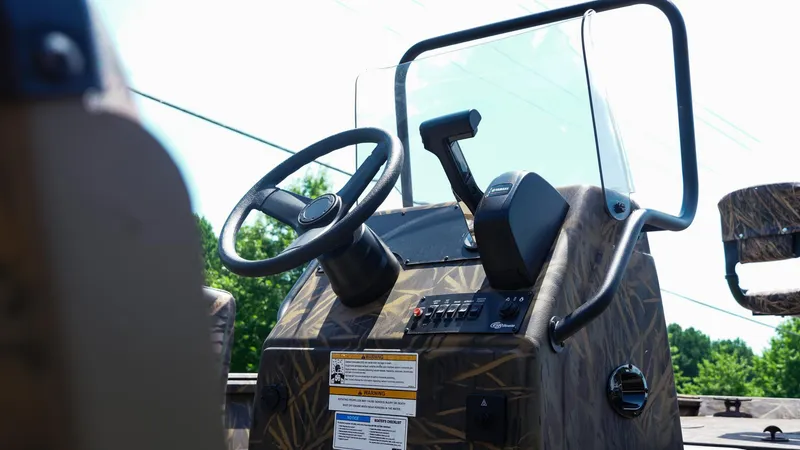Slide: The Image of 2025 G3 Gator Tough 20 CC boat console with steering wheel and controls. - 6