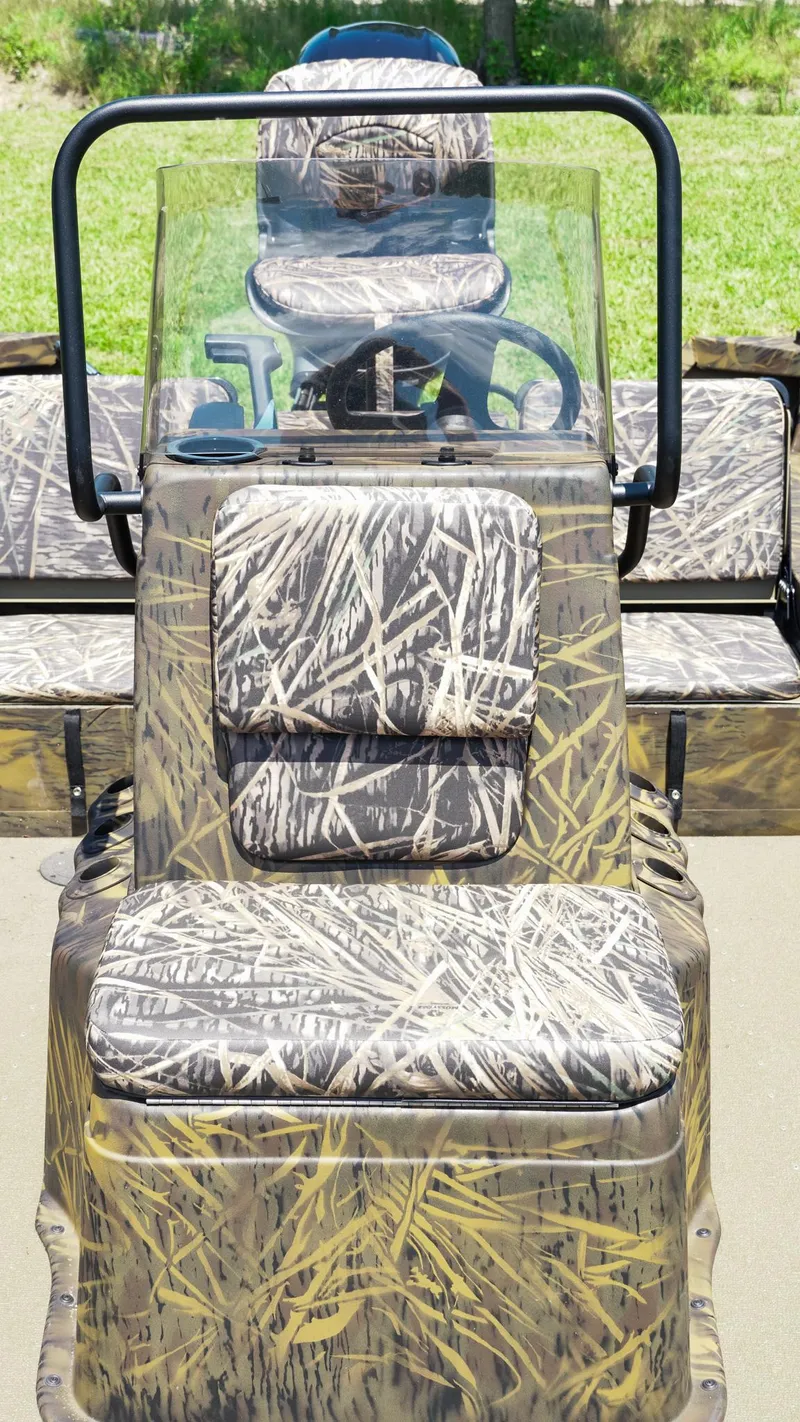 Slide: The Image of 2025 G3 Gator Tough 20 CC boat with camouflage seating and steering console. - 9