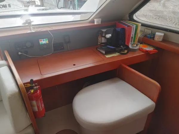 Slide: The Image of Navigation station inside 2011 Leopard 46 yacht with desk, chair, and equipment. - 13