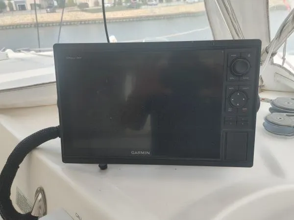 Slide: The Image of Garmin marine GPS device on Leopard 46 yacht, 2011 model, docked by the water. - 14