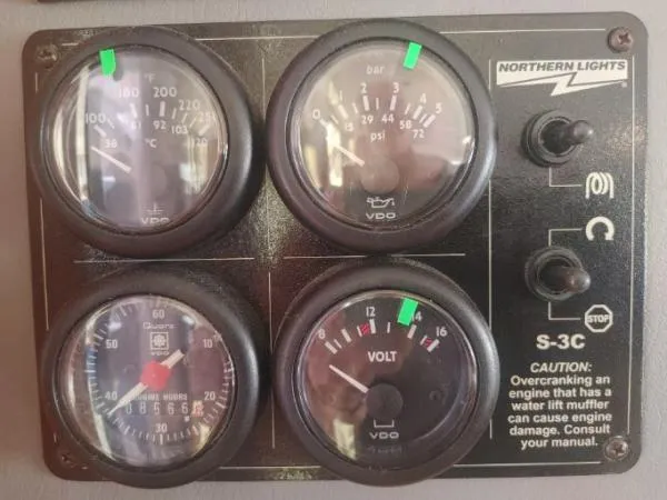 Slide: The Image of Leopard 46 engine control panel with gauges and caution label, 2011 model. - 17