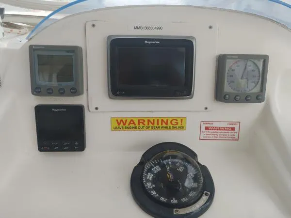 Slide: The Image of Helm dashboard of 2011 Leopard 46 yacht with navigation instruments and compass. - 20