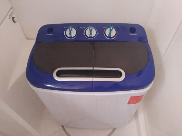 Slide: The Image of Top-loading washing machine, Leopard 46 model, 2011, with blue control panel and three dials. - 23