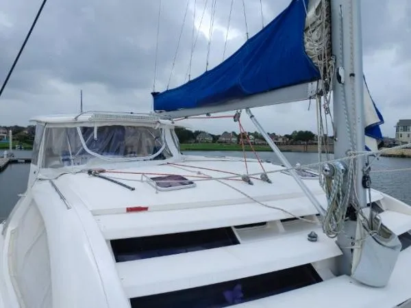 Slide: The Image of Sailing yacht Leopard 46, 2011 model, docked with blue sail cover, overcast sky. - 26
